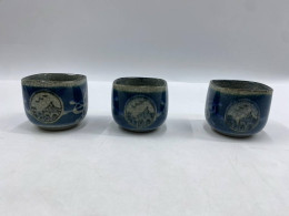 Set of 3 This is a Japanese-style glass tea or sake cup, glazed with a cracked blue and white finish and decorated with hand-painted landscape patterns. Set of 3 This is a Japanese-style glass tea or sake cup, glazed with a cracked blue and white finish and decorated with hand-painted landscape patterns.