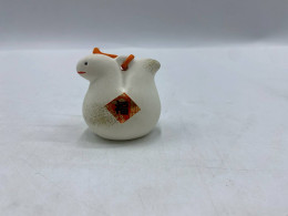 small glass bell-shaped figurine from Japan, presumably symbolizing the animal representing the year of the snake or the rabbit in the Chinese zodiac. small glass bell-shaped figurine from Japan, presumably symbolizing the animal representing the year of the snake or the rabbit in the Chinese zodiac.