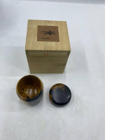 wooden stick with green tea in a wooden box.