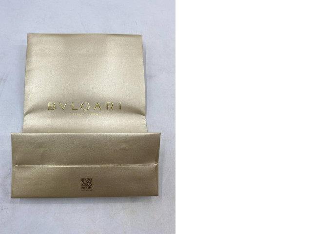gold-colored Bvlgari paper bag. gold-colored Bvlgari paper bag.