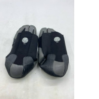  black and grey Rip Curl Dawn Patrol 3mm split toe wetsuit boots made of neoprene. 