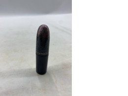  limited edition M·A·C Kiss of Stars lipstick with a glittery finish. 