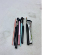 Set of 8  makeup application brushes, including a flat-head foundation or concealer brush.  