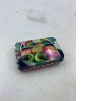 Empty metal box with fruit pattern. 
