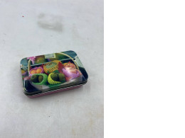 Empty metal box with fruit pattern. 