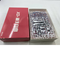 The model kit might be a Gundam-style plastic model kit (Gunpla).