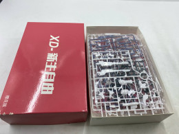 The model kit might be a Gundam-style plastic model kit (Gunpla).