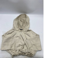 Cream-colored hooded jacket.