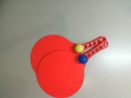 Rackets and balls for playing on the beach