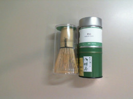 A set of 2 types of Mocha tea with a wooden stirrer.