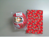 Set, red notebook and Chinese doll