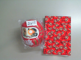 Set, red notebook and Chinese doll