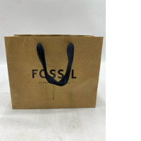 brown Fossil paper gift bag with black rope handles. 