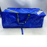  IKEA FRAKTA carrier bag, likely the large size in blue polypropylene with a zipper. 