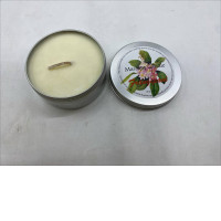  massage candle in a metal tin.