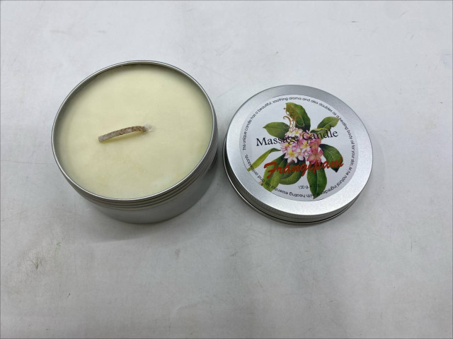 massage candle in a metal tin. massage candle in a metal tin.