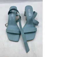  pair of sky blue leather heeled sandals with ankle straps, possibly the "Anna" style from Bloom Paris
