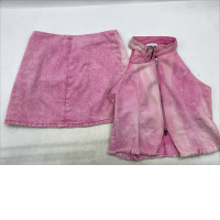 pink acid wash denim mini skirt and matching zip-up halter top set. 