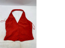 red halterneck suit waistcoat with front buttons and an open back. 