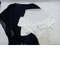 women's apparel including a black sheer top and a white long-sleeved top.