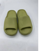 Adidas Yeezy Slide sandals in "Resin" color.