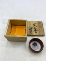 This set of Japanese incense sticks is likely a work by artist Shunpei Kadode, titled "Kaga maki-e".