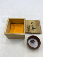 This set of Japanese incense sticks is likely a work by artist Shunpei Kadode, titled "Kaga maki-e".