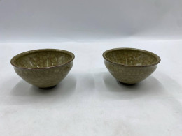 Set of 2 Japanese tea cup with an emerald green glaze and fine crackle glaze is called a yunomi. Set of 2 Japanese tea cup with an emerald green glaze and fine crackle glaze is called a yunomi.