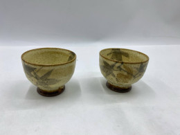 The Yunomi, a Japanese-style glass teacup, features patterns created by applying iron oxide powder to an ash glaze.