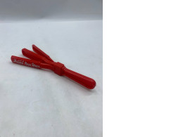 "Happy New Year" red plastic clapping stick.