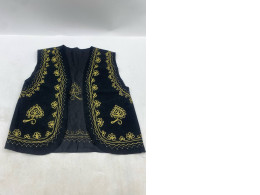 Afghan traditional men's black velvet waistcoat with heavy gold braided embroidery. 