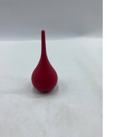 This is a red rubber bulb syringe, a syringe for ear or mouth sores.