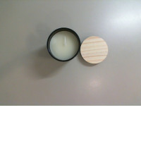 Candle in a ceramic flask with a lid