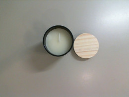 Candle in a ceramic flask with a lid