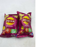 Set of 2 Lay's Mexican Chicken and Tomato Flavored Potato Chips. 
