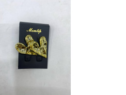 Gold heart-shaped earrings for women.