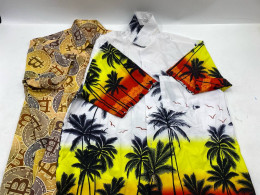 set of 2 Two men's short-sleeved button-down Hawaiian shirts, one with a tropical palm tree pattern.