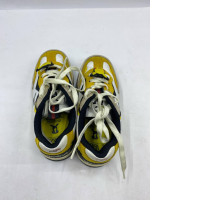 Aimé Leon Dore x New Balance 827 Abzorb sneakers in yellow and white.