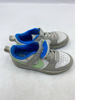 f Nike Court Borough Low Recraft PS shoes in the Light Iron Ore, White, Photo Blue, and Vapor Green colorway. 