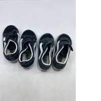 Set of 2 black and white Vans Toddler Old Skool V shoes with hook-and-loop closures.  