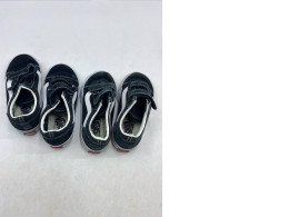 Set of 2 black and white Vans Toddler Old Skool V shoes with hook-and-loop closures.  