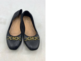  Naturalizer or Charles & Keith black leather-look ballerina flats with gold chain-link accents. 