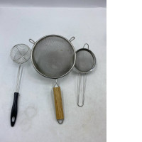 Set of 3 Stainless steel strainers and wire colanders are kitchen utensils.