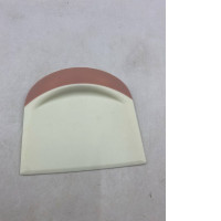 Dough scrapers or curved bowls are usually made of silicone or plastic.