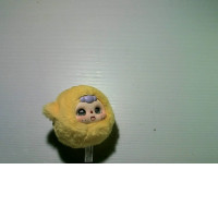 Yellow Labubu toy, crying baby.