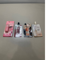 A set of four Maybelline mini lip glosses A set of four Maybelline mini lip glosses