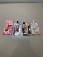 A set of four Maybelline mini lip glosses