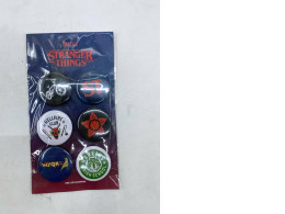 Stranger Things themed button pins. Stranger Things themed button pins.
