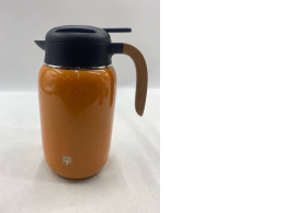 double-walled stainless steel thermal coffee carafe with a press button lid and a wooden handle. 