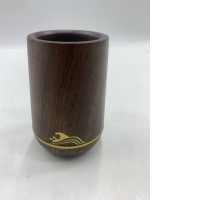 This wooden cup is made from dark hardwood.